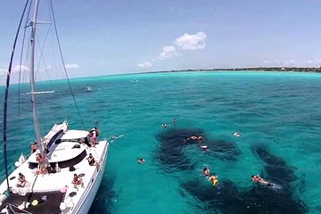Isla Mujeres enchanting Catamaran tour. Snorkeling in the Caribbean Sea.