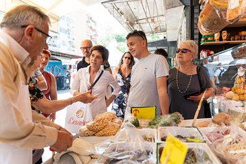 Local market visit and private cooking class at a Cesarina's home in Parma