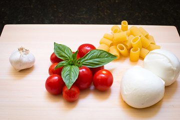 Local market visit and private cooking class at a Cesarina's home in Lucca
