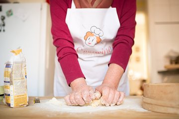 Local market visit and private cooking class at a Cesarina's home in Messina
